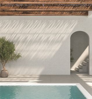 Ecke eines Pools. Im Hintergrund stehen zwei Topfpflanzen und ein Treppenaufgang ist zu sehen