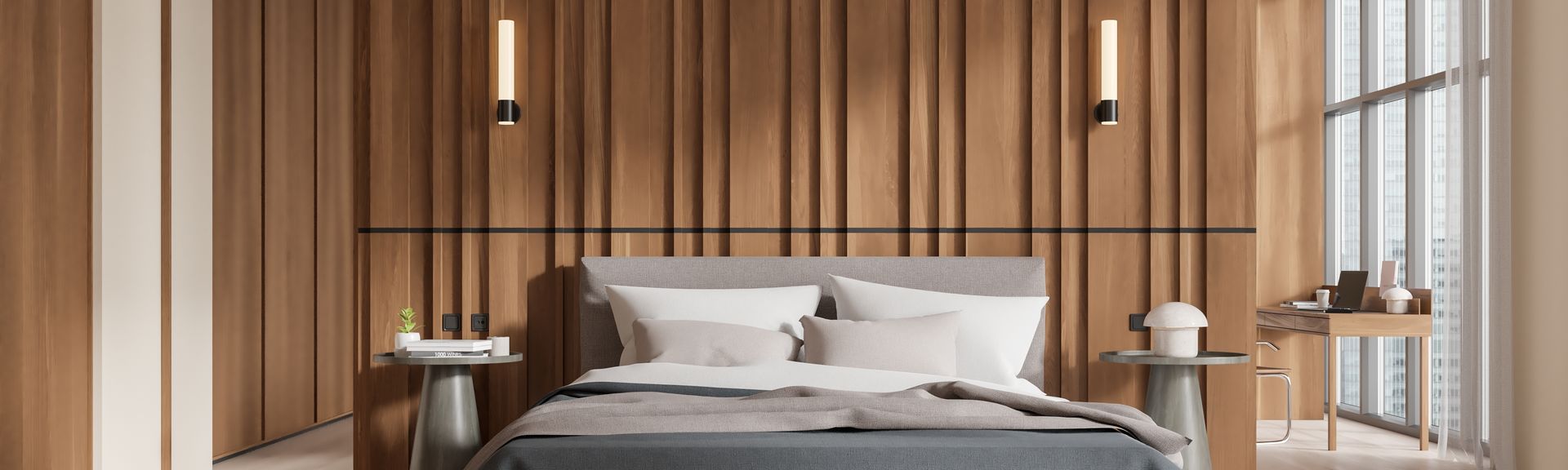 Ein modernes Hotelzimmer mit einem großen Doppelbett in der Mitte